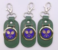 Three boxed Rolex Wimbledon Tennis key fobs. Each 10.5 cm high overall.