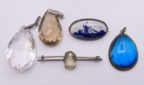 A silver single stone brooch, a Delft porcelain brooch,