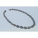 A vintage graduated blue stone necklace. 40 cm long.