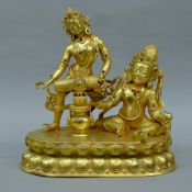 A gilt bronze double deity figure. 28.5 cm high.