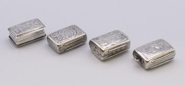 A small Georgian silver vinaigrette and three Victorian silver vinaigrettes.
