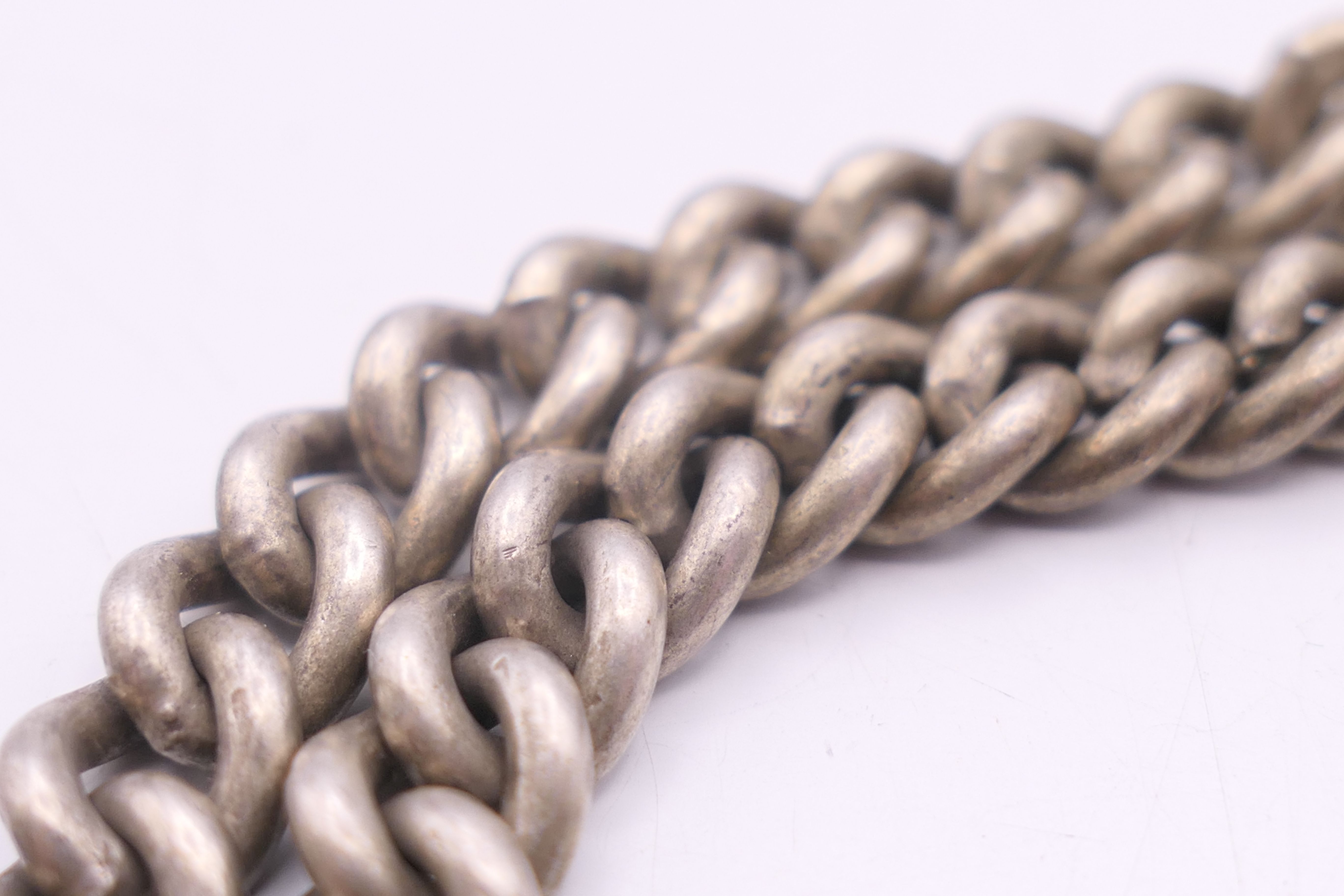 A silver Albert pocket watch chain and fob, the fob engraved AJR 1901 HQC. 38 cm long, fob 3. - Image 6 of 6