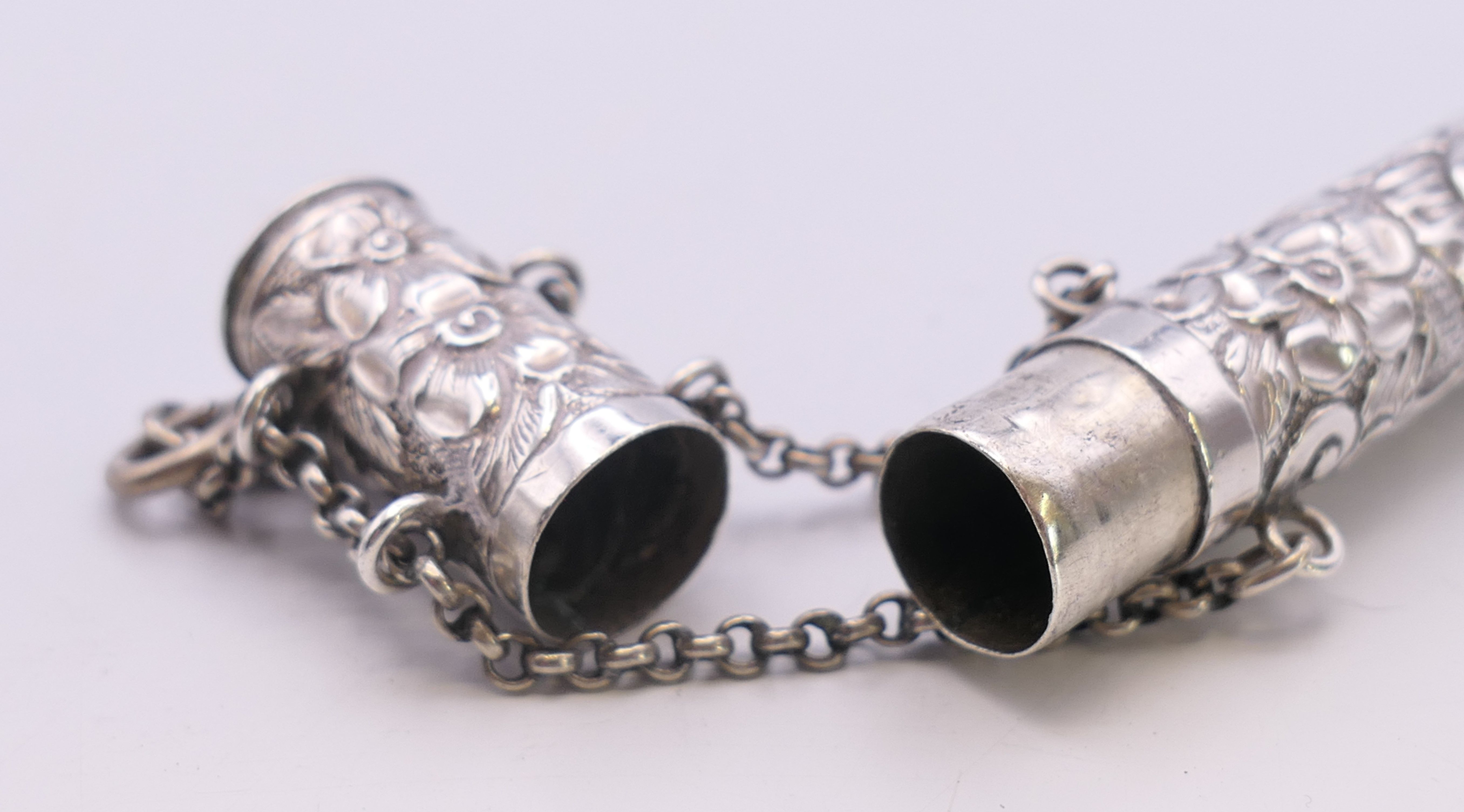 An embossed silver needle case. 14 cm high. - Image 5 of 5