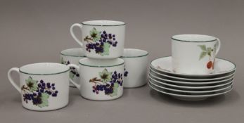 A quantity of Royal Worcester Evesham Vale porcelain. The cups 6.5 cm high.