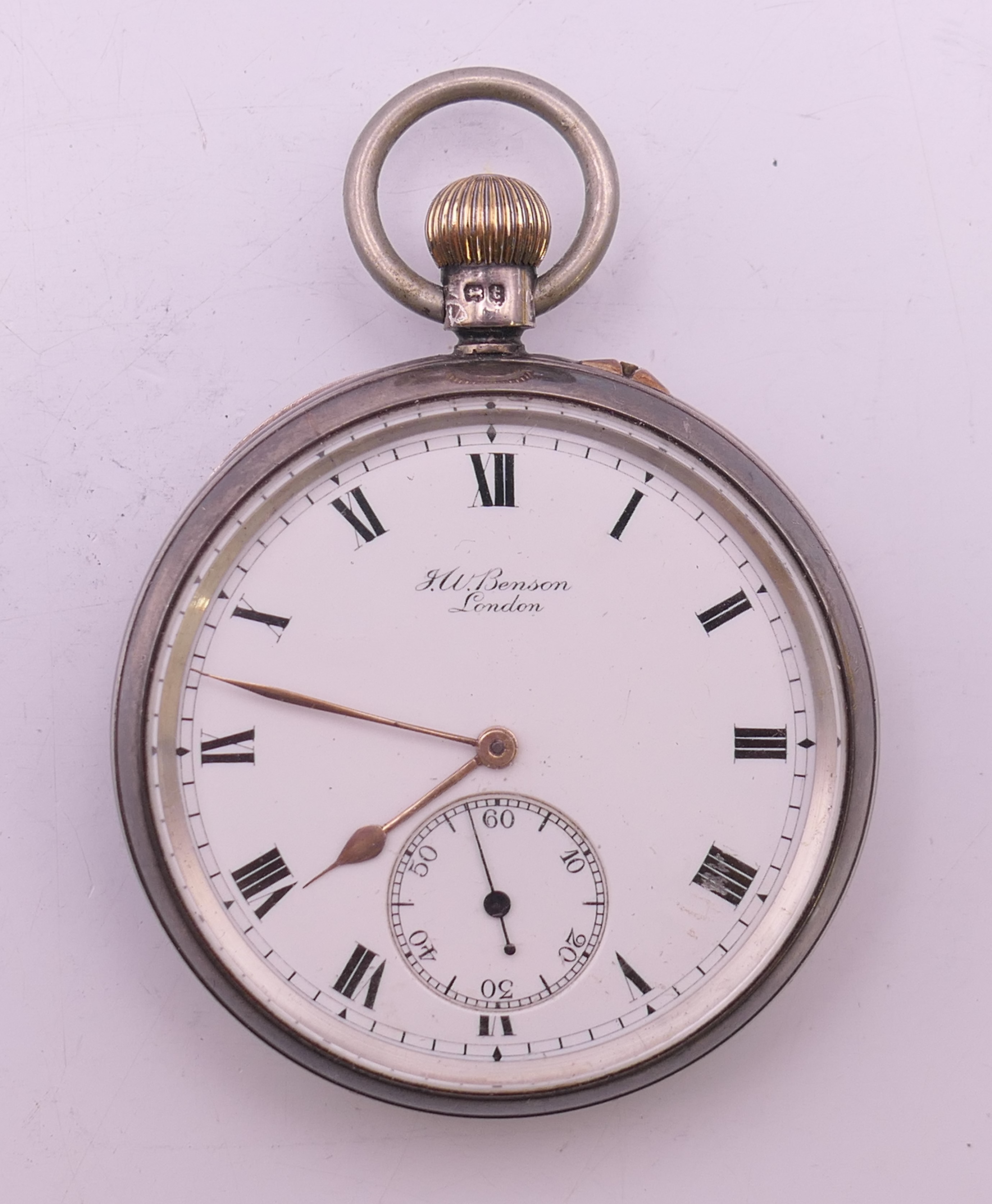 A J W Benson silver pocket watch. 5.25 cm diameter.