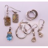 Four pairs of silver earrings and a silver pendant. Abalone earrings 1.