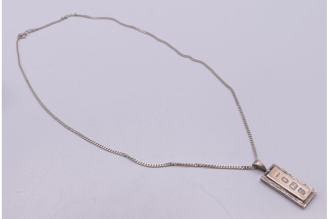 A silver ingot pendant on a silver chain. - Image 2 of 6