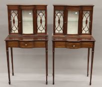 A pair of Edwardian-style glazed mahogany side cabinets. 60 cm wide x 116.5 cm high.