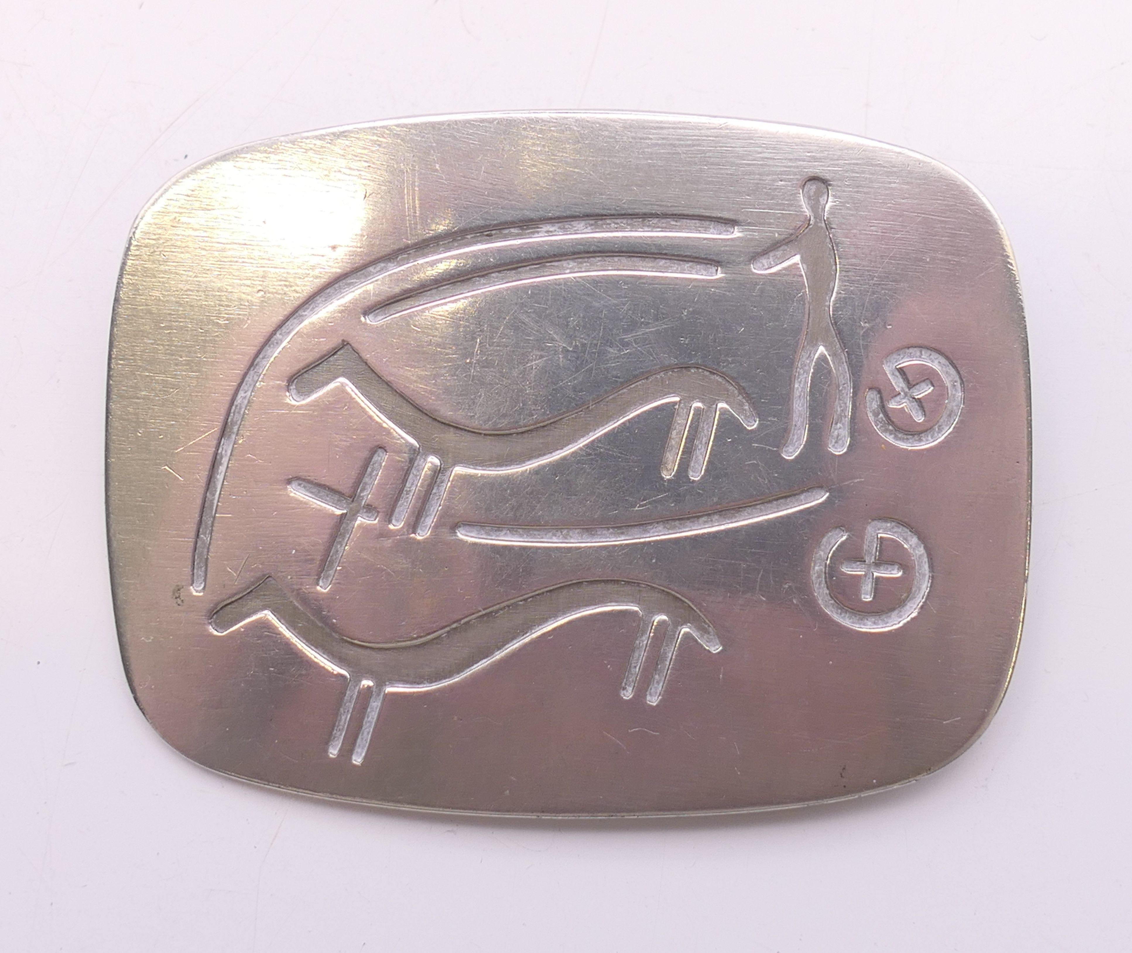 A Georg Jensen pewter brooch with stylised charioteer with horses, marked PEWTER, Handmade, Denmark,