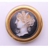A 19th century unmarked cameo brooch. 2.5 cm diameter. 7 grammes total weight.