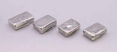 Four Georgian silver vinaigrettes. The larger 2.5 x 1.75 cm.