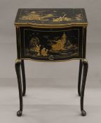 An early 20th century chinoiserie lacquered work/sewing table. 48.5 cm wide.