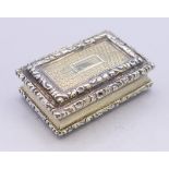 A Nathaniel Mills silver gilt vinaigrette. 3.5 cm x 2.5 cm.