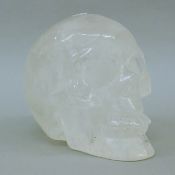 A rock crystal skull. 14 cm high.