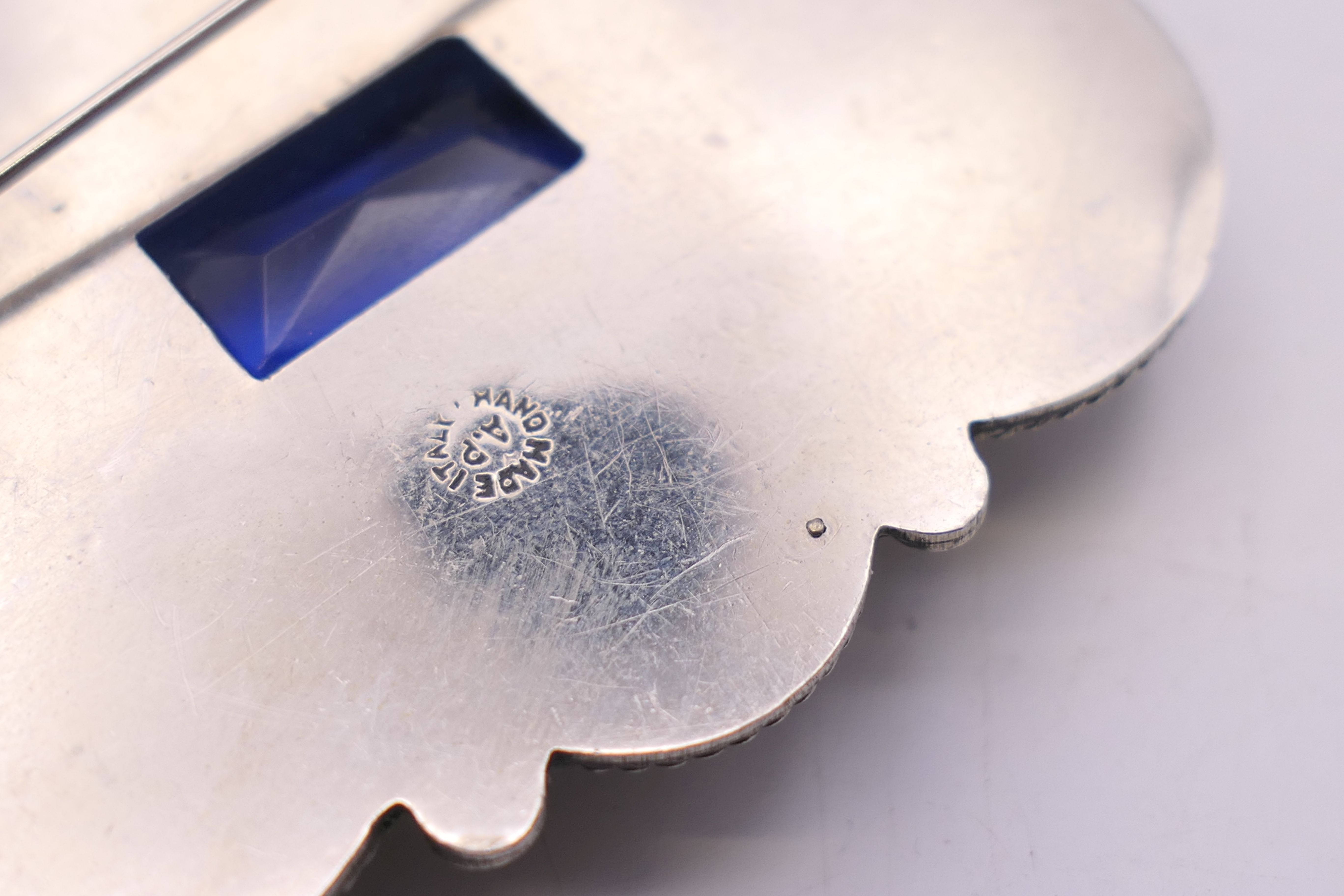 An Italian silver brooch with blue central stone. 5.25 cm x 4.5 cm. - Image 4 of 4
