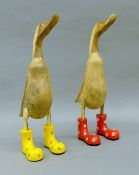 Two wooden ducks in Wellington boots. Each 46.5 cm high.