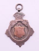 A silver fob with rose gold inlay. 4.5 cm high.