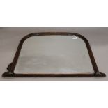 An overmantle mirror. 150 cm wide.