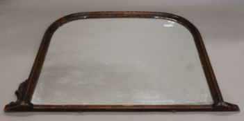 An overmantle mirror. 150 cm wide.