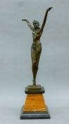 A bronze of an Art Deco dancing girl on a marble base. 54.5 cm high.