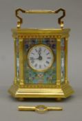 An hexagonal cloisonne carriage clock. 17.5 cm high.