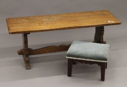 An oak coffee table and an upholstered foot stool. The former 106 cm long x 41 cm high.