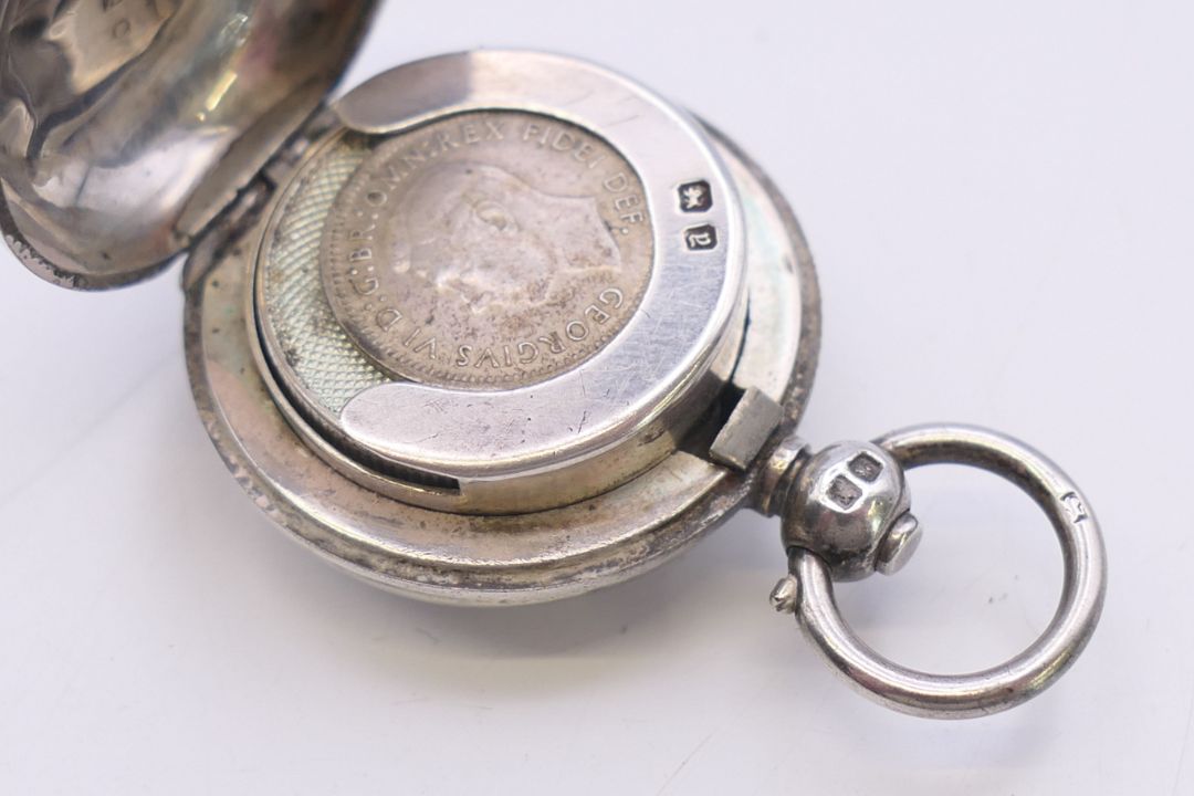 A silver sovereign holder. 4.5 cm high including suspension loop. - Image 4 of 6
