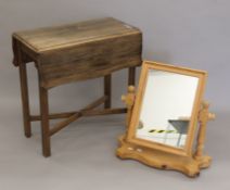 A small Pembroke table and a pine mirror. The latter 50.5 cm wide.