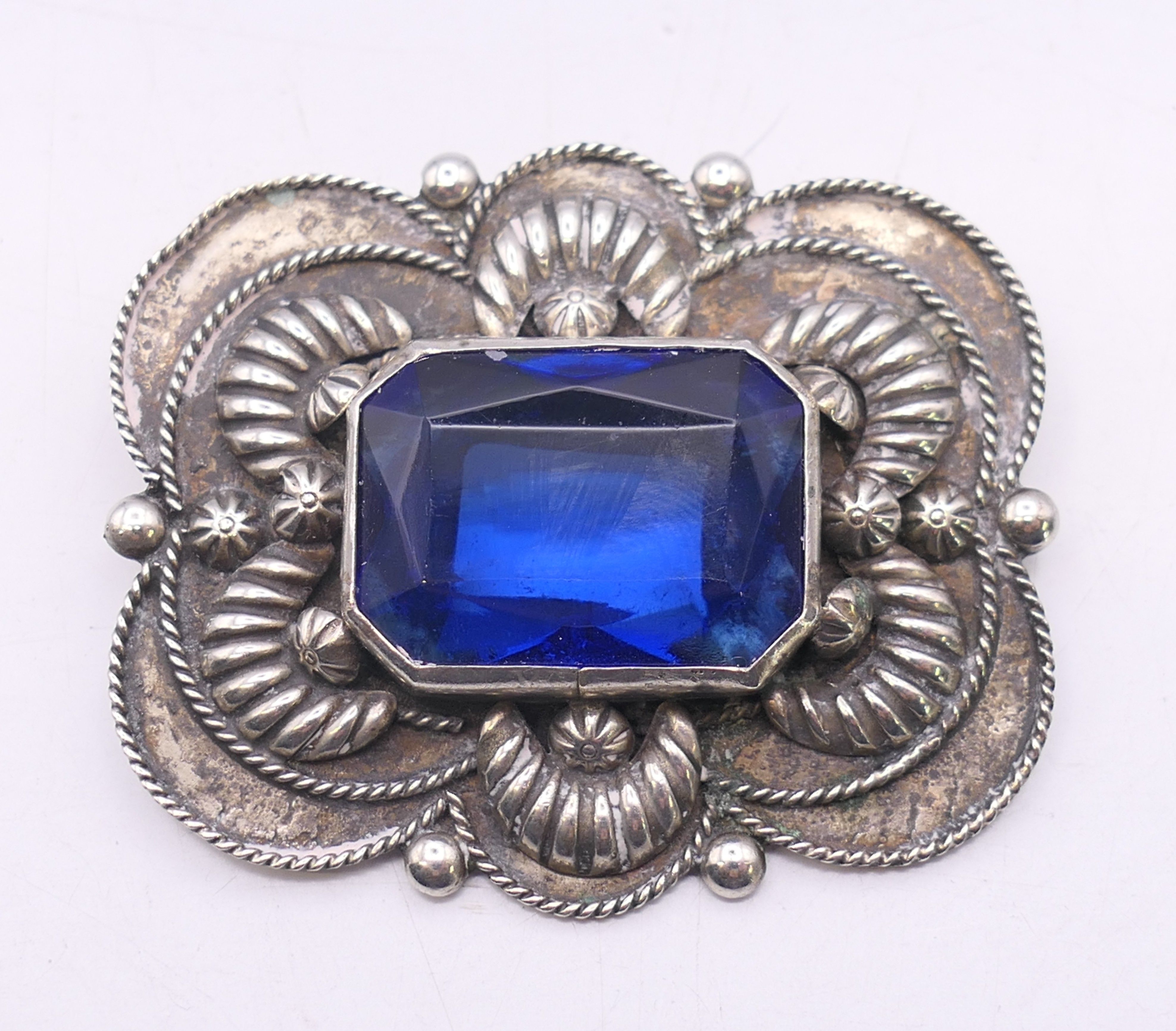 An Italian silver brooch with blue central stone. 5.25 cm x 4.5 cm.