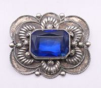 An Italian silver brooch with blue central stone. 5.25 cm x 4.5 cm.