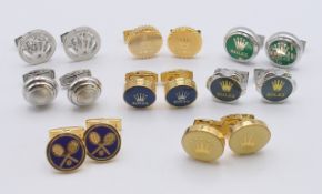Eight pairs of Rolex cufflinks in a wooden Rolex box. Largest 2 cm diameter.