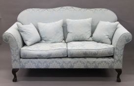 A Wesley Barrell camel-back settee. 175 cm wide.