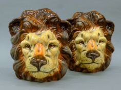 A pair of porcelain lionheart vases. Each 21 cm high.