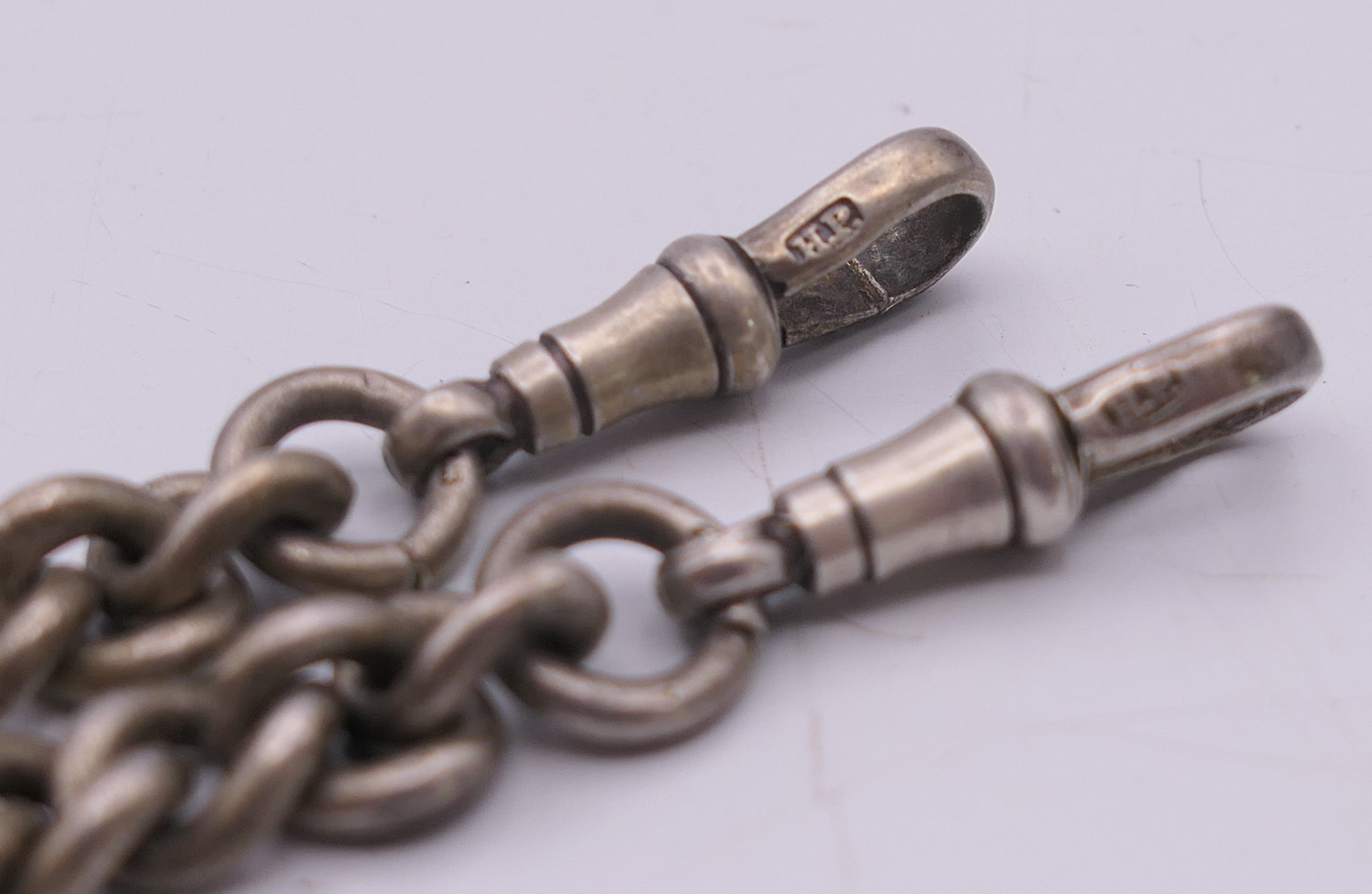 A silver Albert pocket watch chain and fob, the fob engraved AJR 1901 HQC. 38 cm long, fob 3. - Image 5 of 6