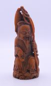 A figure of a deity. 13 cm high.