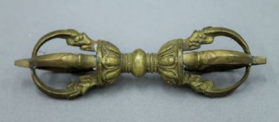 A Tibetan bronze vajra. 12 cm long.