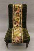 A Victorian tapestry-covered nursing chair. 56 cm wide.