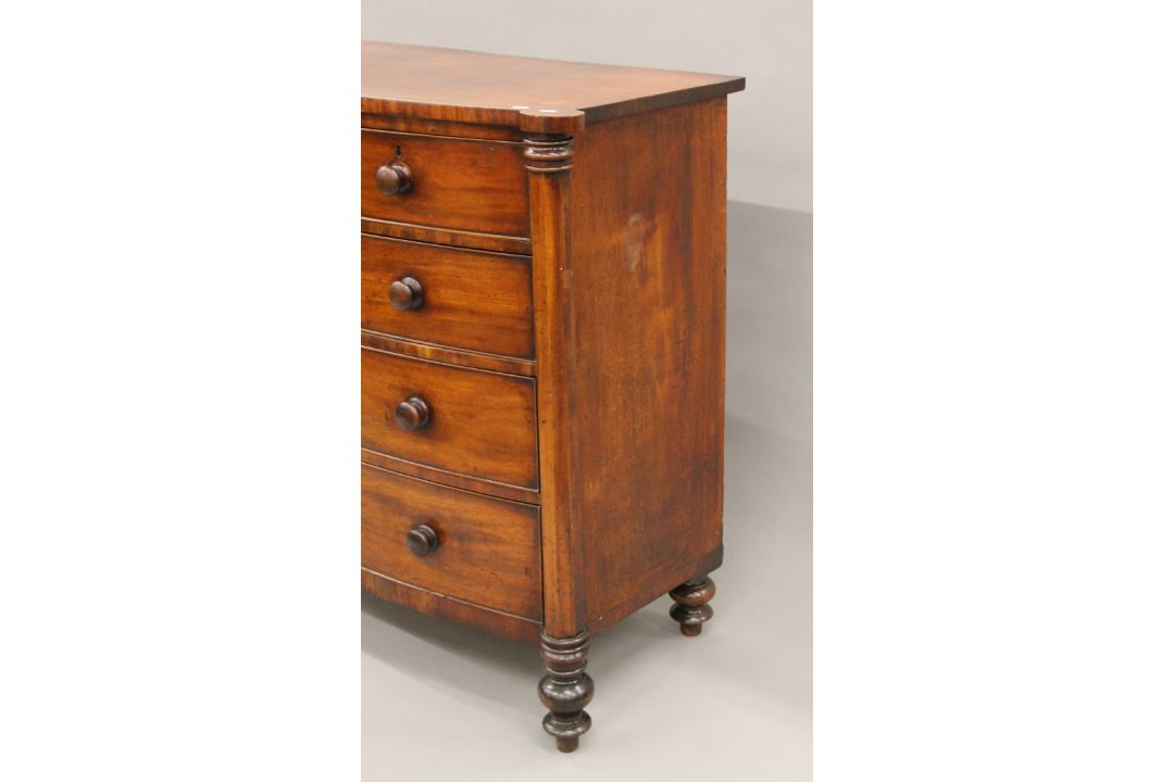 A Georgian mahogany bow-front two-over-three chest of drawers. 124 cm wide x 114 cm high. - Image 3 of 7