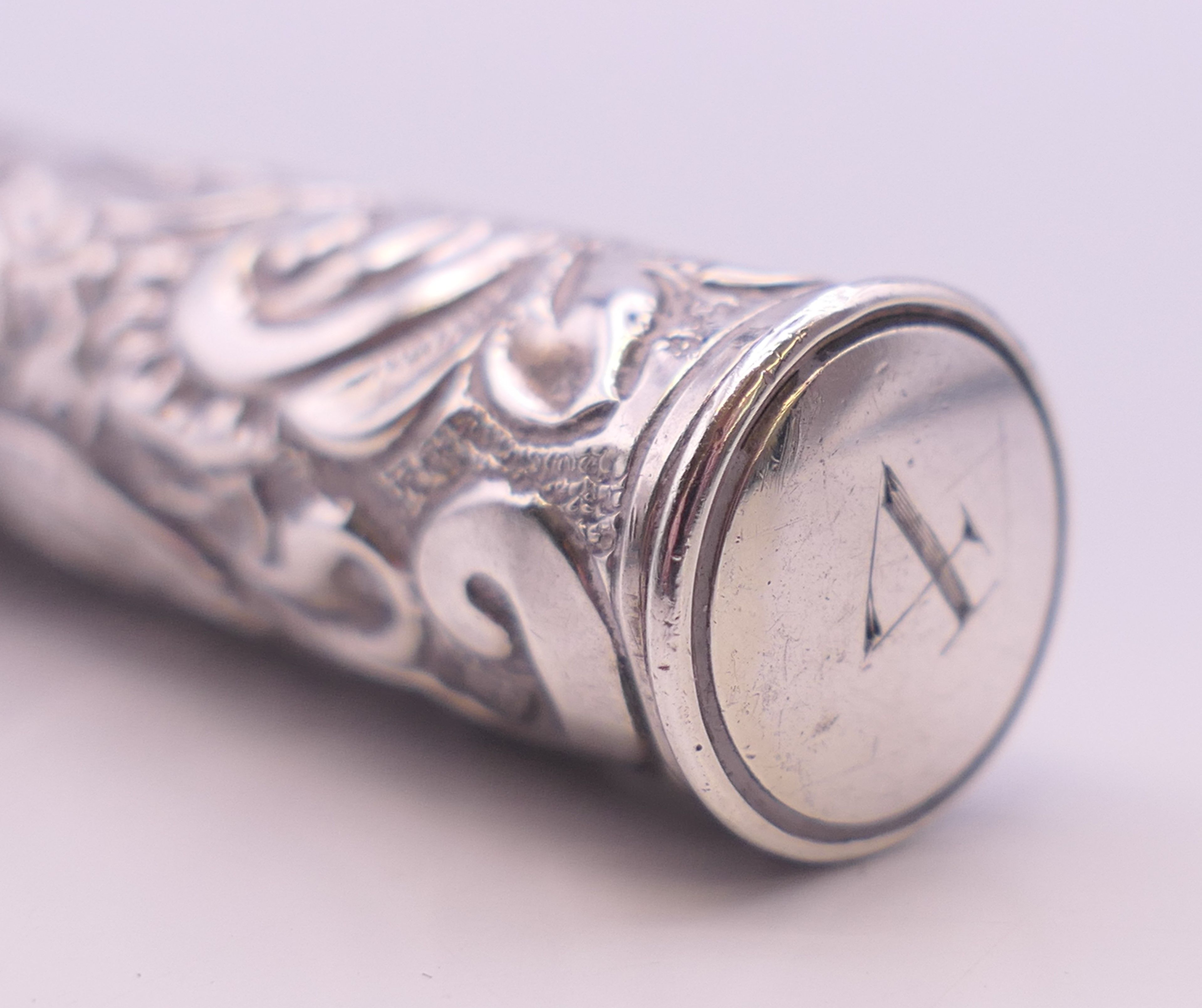 An embossed silver needle case. 14 cm high. - Image 4 of 5