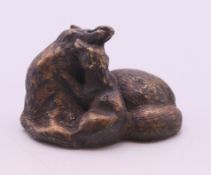 A small bronze of a fox and pup. 2.5 cm high.