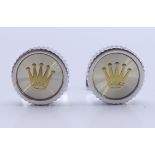 A set of Rolex cufflinks in a Penrose of London box. 1.75 cm diameter.