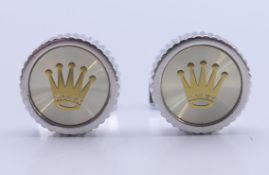 A set of Rolex cufflinks in a Penrose of London box. 1.75 cm diameter.