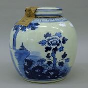 A Chinese blue and white porcelain tea jar. 24 cm high.