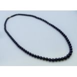A lapis graduated bead necklace. 75 cm long.
