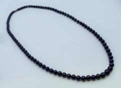 A lapis graduated bead necklace. 75 cm long.