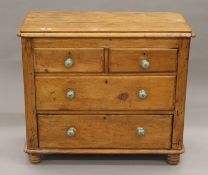 A small Victorian pine chest of drawers with later handles. 88 cm wide x 78 cm high.