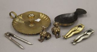 A quantity of metal items including nutcrackers, a chamber stick etc. The latter 16 cm diameter.