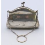 A silver purse. 8 cm x 10 cm. 72 grammes total weight.