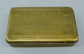 A brass 'Cocaine' box. 13 cm wide.