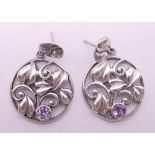 A pair of silver and amethyst earrings. 4 cm high.